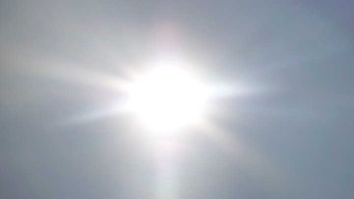 Sun shining through clouds